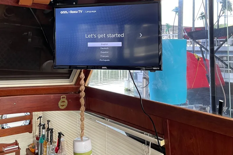 Slide: The Image of TV setup on 1985 Marinette 32 Sedan Flybridge boat interior. - 8