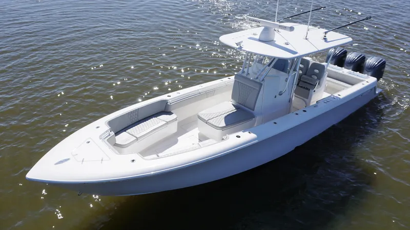 Slide: The Image of 2023 Contender 35 ST boat on water, featuring sleek design and triple outboard engines. - 1