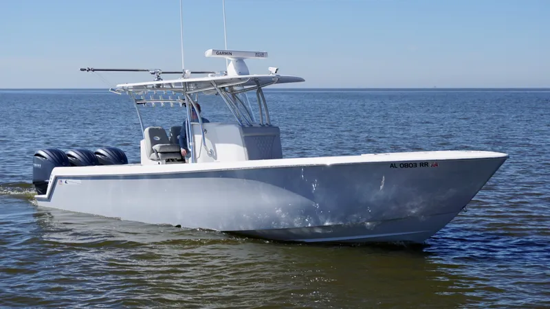 Slide: The Image of 2023 Contender 35 ST boat on calm water, featuring triple outboard engines. - 7
