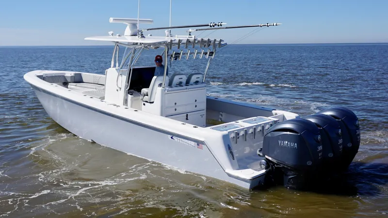 Slide: The Image of 2023 Contender 35 ST boat with triple Yamaha engines on open water. - 8