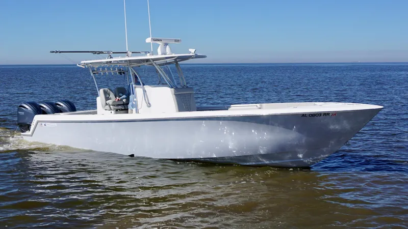 Slide: The Image of 2023 Contender 35 ST boat cruising on open water, featuring triple outboard engines. - 9