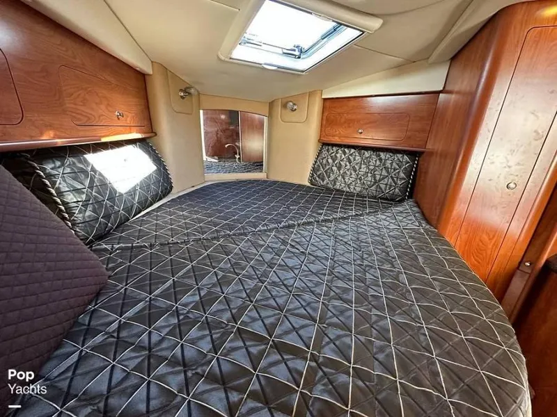Slide: The Image of Interior of 2013 Rinker 310 Express Cruiser with cozy bed. - 17