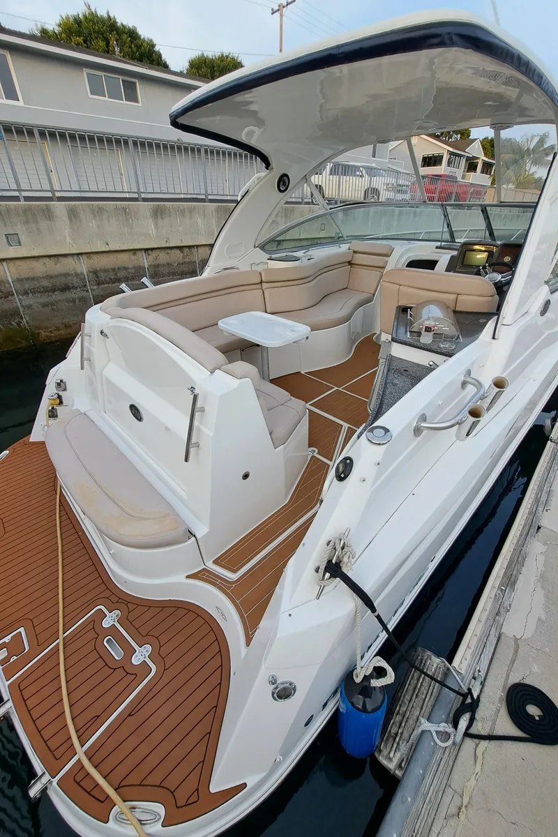 Slide: The Image of 2013 Rinker 310 Express Cruiser with spacious cockpit and elegant design. - 7