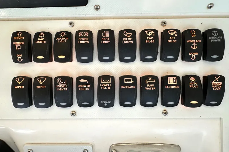 Slide: The Image of Control switches on a 1997 Sea Ray 370 Express Cruiser dashboard. - 14
