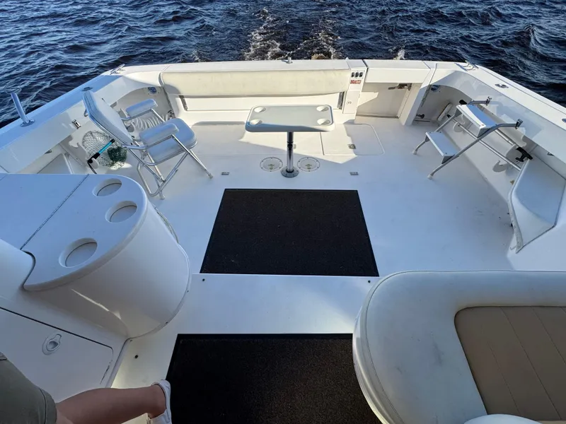 Slide: The Image of 1997 Sea Ray 370 Express Cruiser helm with steering wheel, controls, and communication devices. - 18
