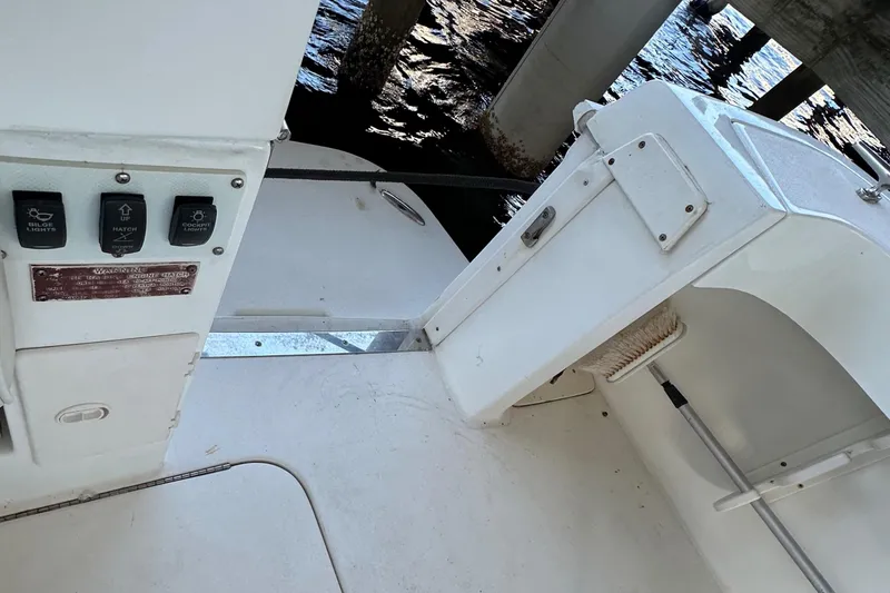 Slide: The Image of 1997 Sea Ray 370 Express Cruiser docked, rear view with spacious deck and seating area. - 20