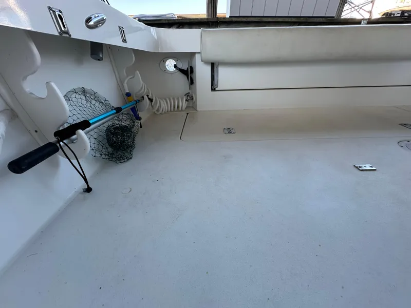 Slide: The Image of 1997 Sea Ray 370 Express Cruiser interior with control panel and seating. - 23