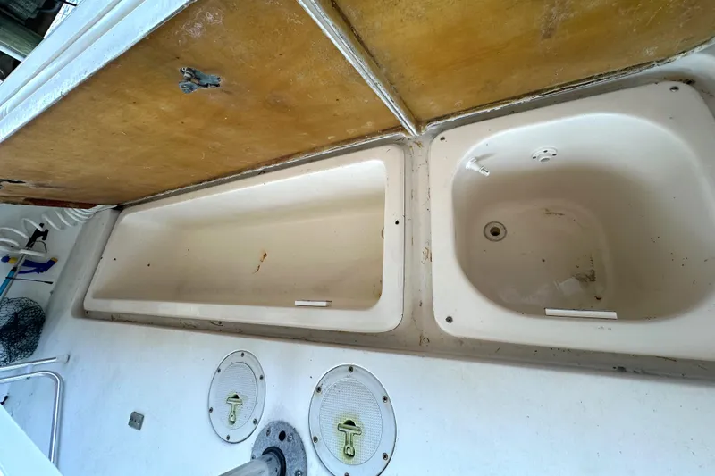 Slide: The Image of Control panel of a 1997 Sea Ray 370 Express Cruiser showing engine switches. - 28