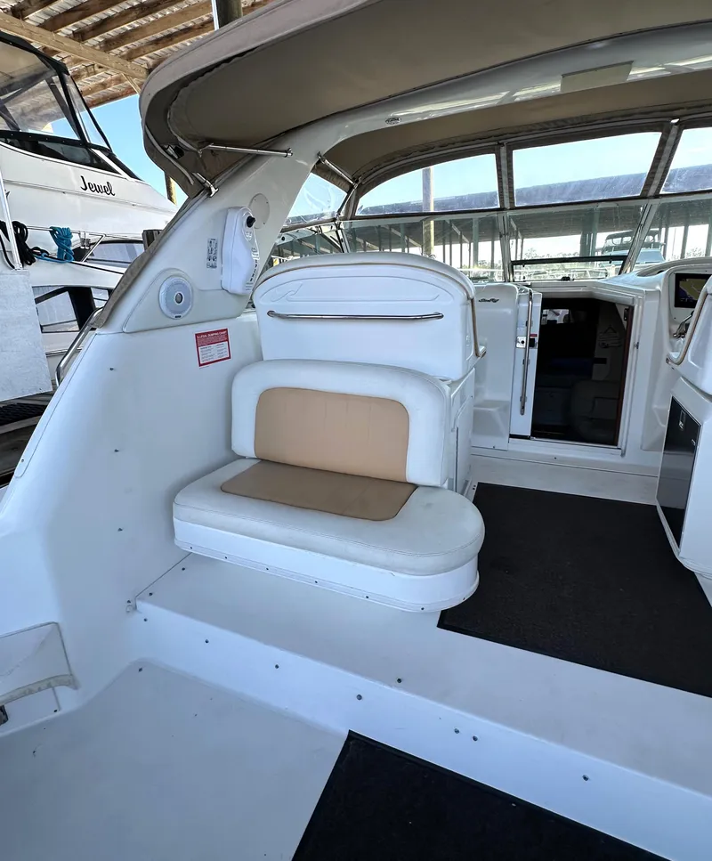 Slide: The Image of 1997 Sea Ray 370 Express Cruiser swim platform with foldable ladder and open hatch. - 32