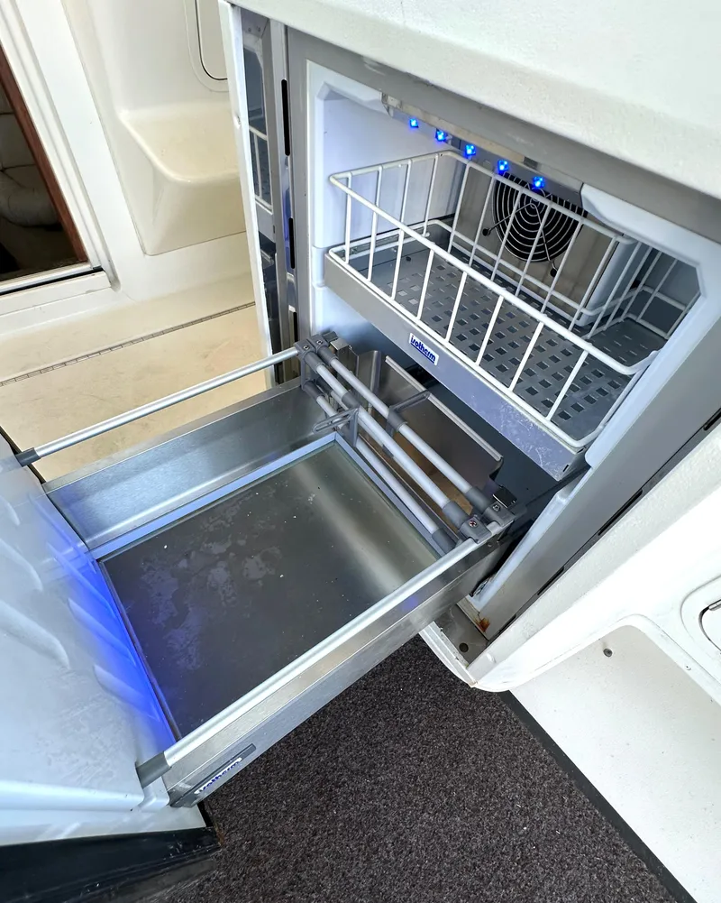 Slide: The Image of 1997 Sea Ray 370 Express Cruiser interior with storage compartments and seating. - 34