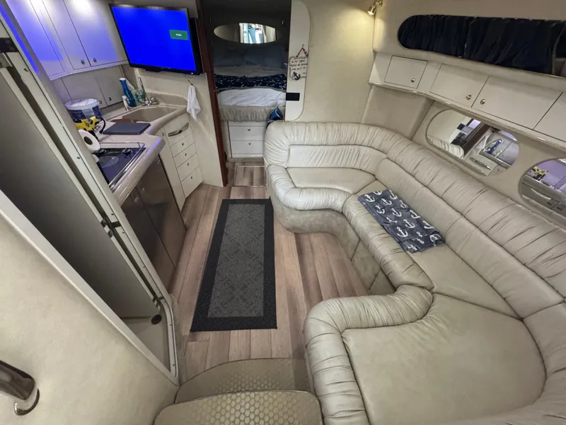 Slide: The Image of Electrical panel inside 1997 Sea Ray 370 Express Cruiser, featuring various switches and controls. - 36