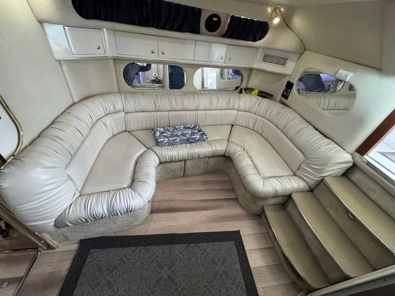 Slide: The Image of 1997 Sea Ray 370 Express Cruiser interior with plush seating and elegant design. - 37