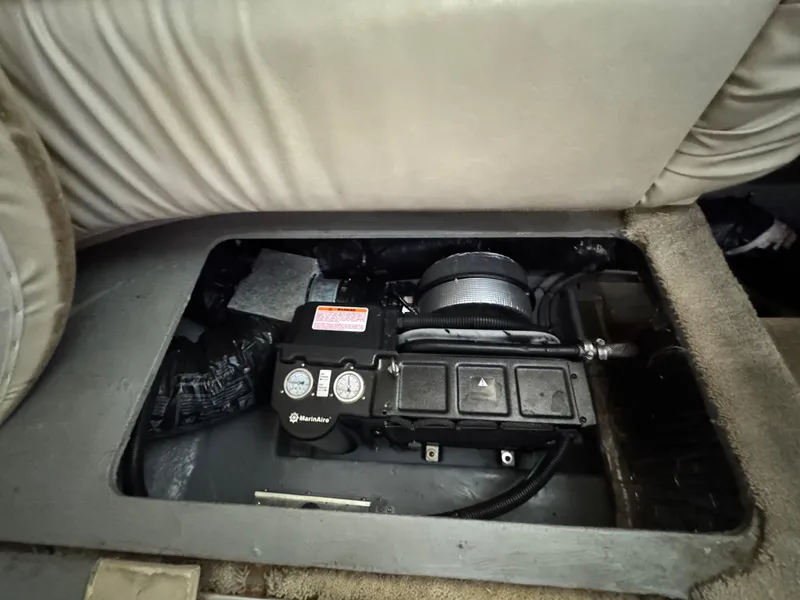 Slide: The Image of 1997 Sea Ray 370 Express Cruiser interior compartment with mechanical components visible. - 40