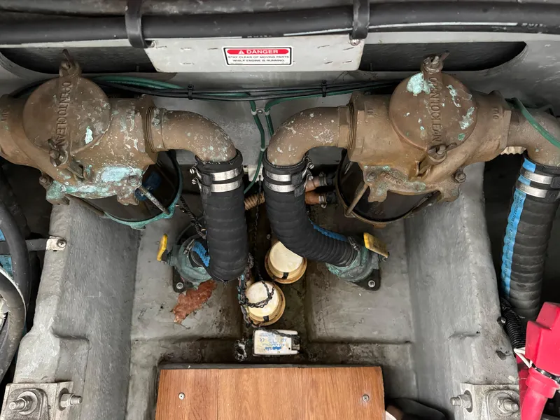 Slide: The Image of Engine compartment of a 1997 Sea Ray 370 Express Cruiser, showing dual exhaust systems. - 49