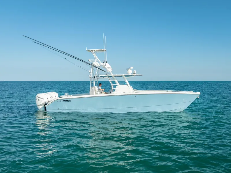 Slide: The Image of 2023 Invincible 37 Catamaran on open water, side view. - 0