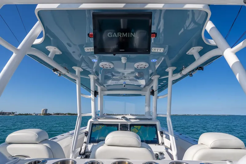 Slide: The Image of 2023 Invincible 37 Catamaran helm with Garmin display on open water. - 33
