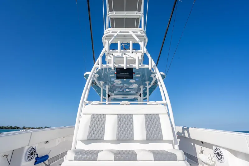 Slide: The Image of 2023 Invincible 37 Catamaran with sleek seating and advanced navigation system. - 39