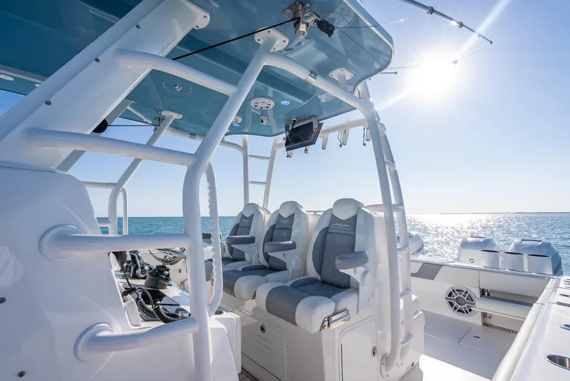 Slide: The Image of 2023 Invincible 37 Catamaran interior with luxurious seating, ocean view, and sunny sky. - 42
