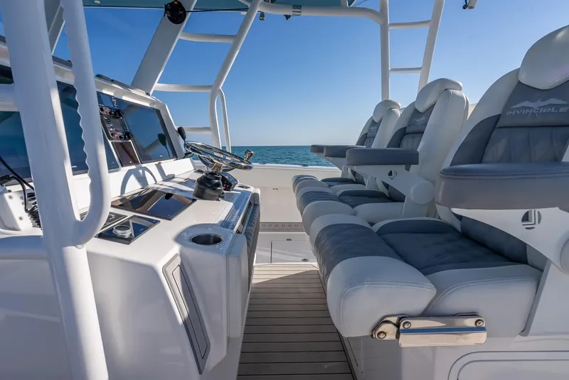 Slide: The Image of 2023 Invincible 37 Catamaran interior with modern helm and luxurious seating. - 43