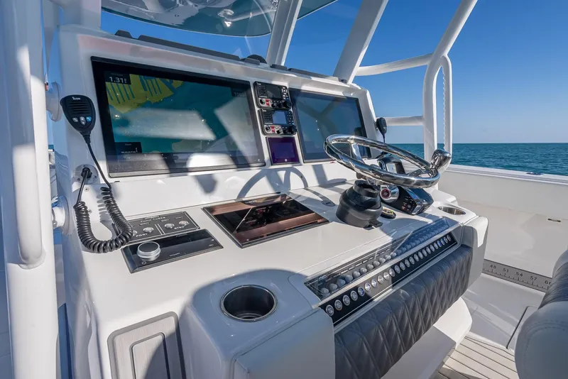 Slide: The Image of Control panel of 2023 Invincible 37 Catamaran with advanced navigation systems. - 45
