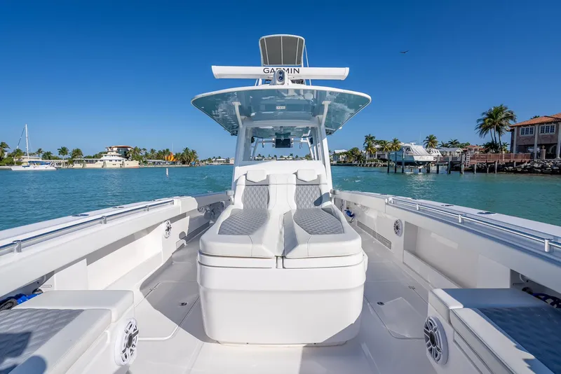 Slide: The Image of 2023 Invincible 37 Catamaran on clear blue water, showcasing sleek design and spacious deck. - 48