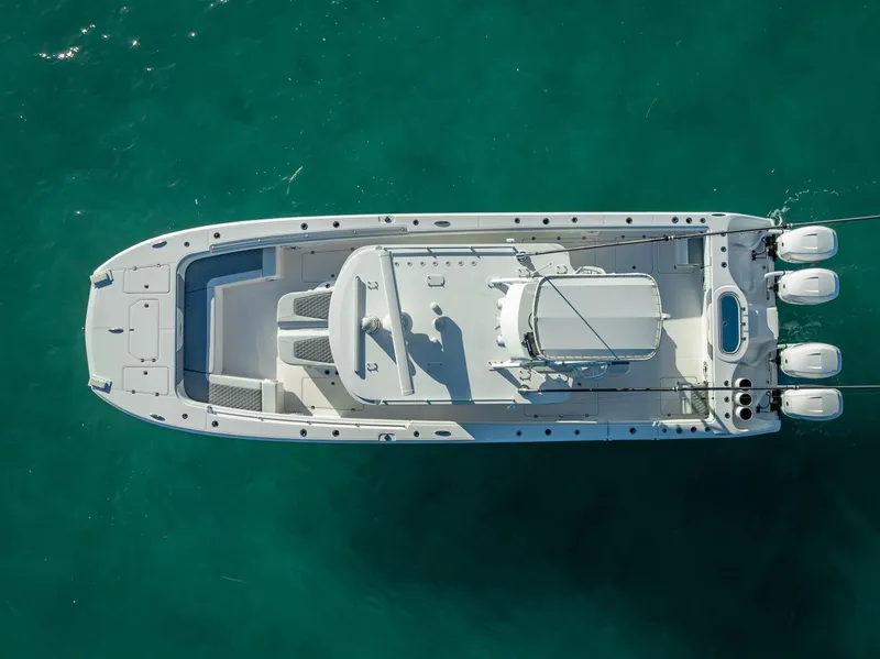 Slide: The Image of Aerial view of 2023 Invincible 37 Catamaran on turquoise water. - 8