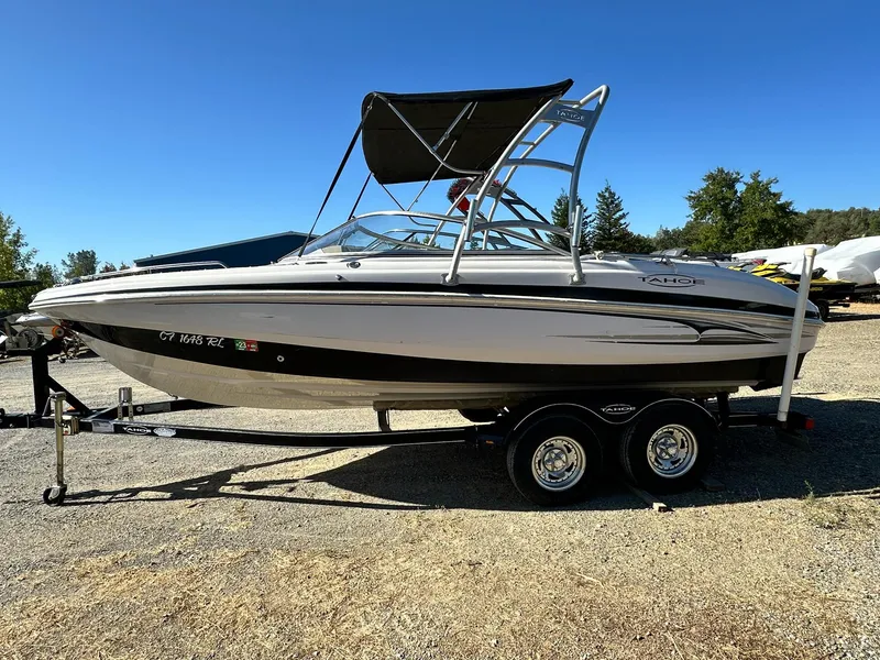 Slide: The Image of 2006 Tahoe 215 I/O boat on trailer, side view, sunny day. - 2