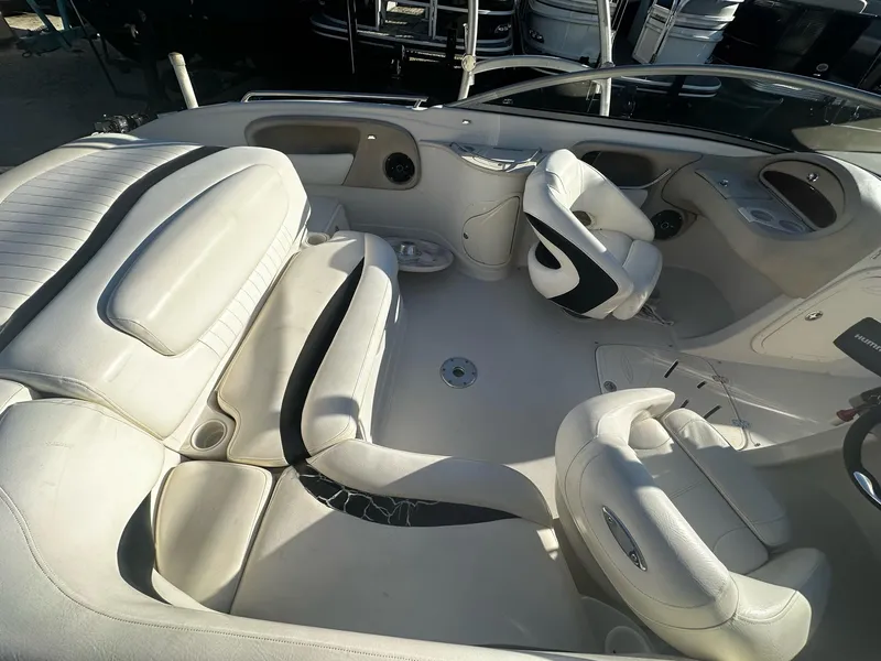 Slide: The Image of Interior of a 2006 Tahoe 215 I/O boat with white seating and steering wheel. - 6