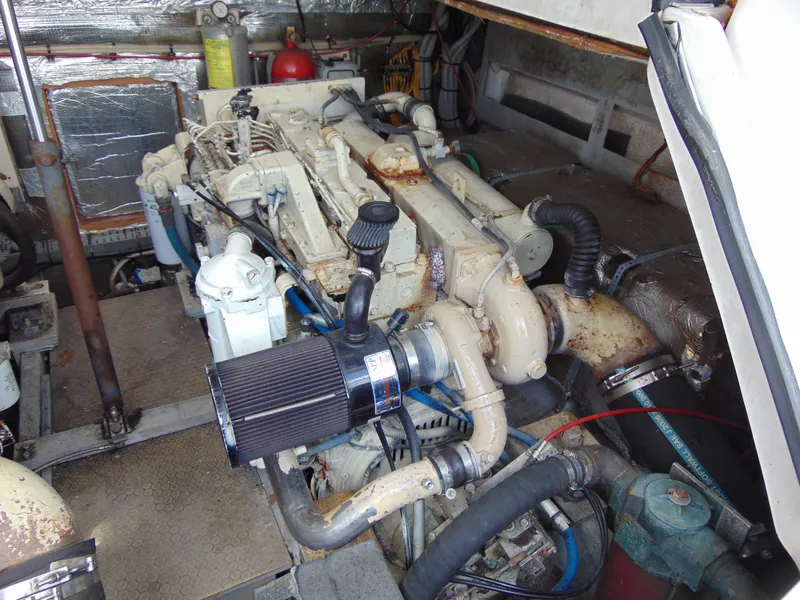 Slide: The Image of Engine room of 2000 Luhrs T-360SX/SF boat, showcasing mechanical components and equipment. - 19