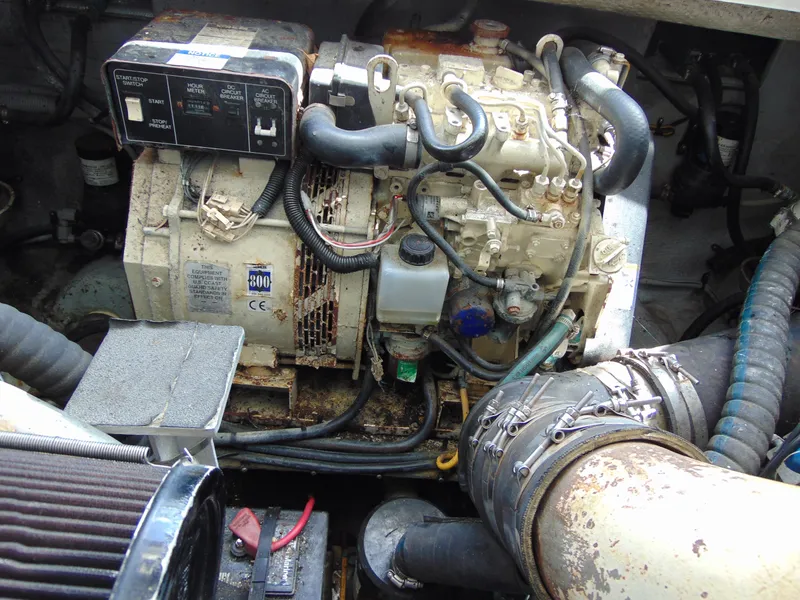 Slide: The Image of Engine compartment of a 2000 Luhrs T-360SX/SF boat, showing detailed mechanical components. - 21