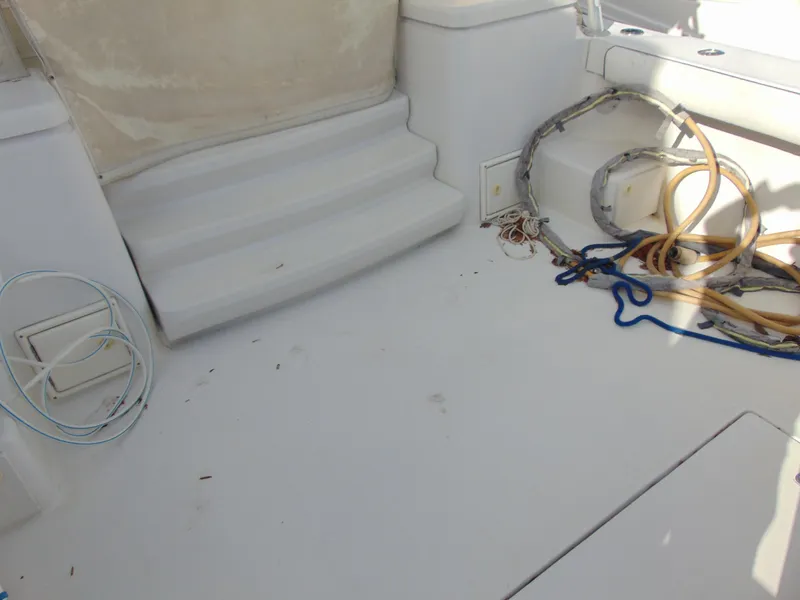 Slide: The Image of 2000 Luhrs T-360SX/SF boat deck with steps and coiled ropes. - 6