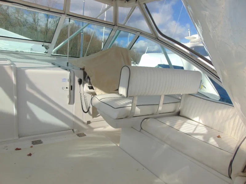 Slide: The Image of 2000 Luhrs T-360SX/SF boat interior with white seating and helm station. - 9