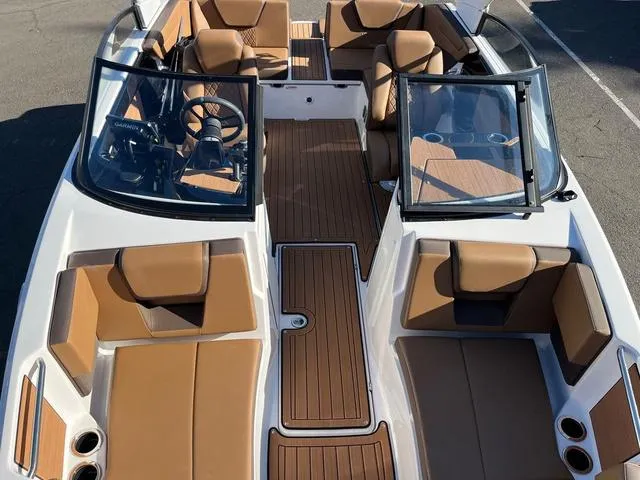Slide: The Image of 2024 Yamaha Boats 222S interior with tan seating and sleek design. - 4