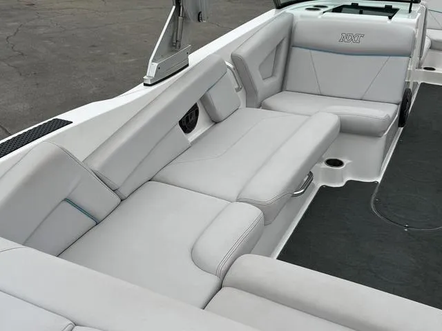 Slide: The Image of 2019 MasterCraft NXT22 boat interior with spacious seating and modern design. - 12