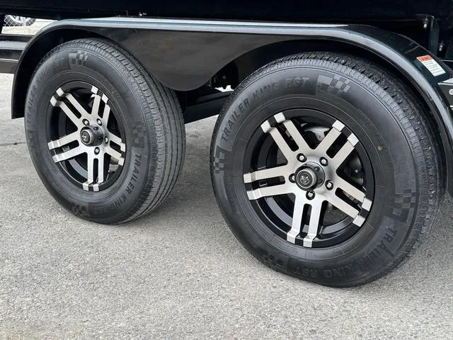 Slide: The Image of 2019 MasterCraft NXT22 boat interior with white cushioned seating and cup holders. - 9