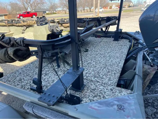 Slide: The Image of 2003 Lowe Roughneck boat with camouflage deck and steering console. - 5