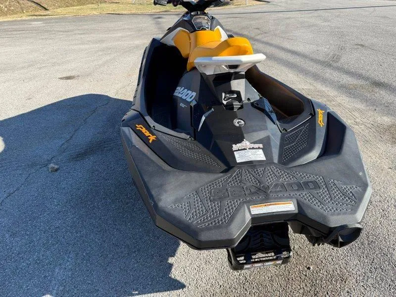Slide: The Image of 2018 Sea-Doo Spark 3up jet ski with yellow seat on pavement. - 11