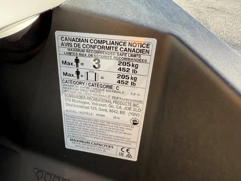 Slide: The Image of Canadian compliance notice on 2018 Sea-Doo Spark 3up, showing weight and capacity limits. - 18
