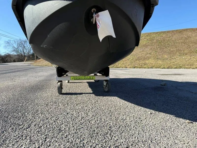 Slide: The Image of 2018 Sea-Doo Spark 3up on a trailer, parked on a sunny road. - 21