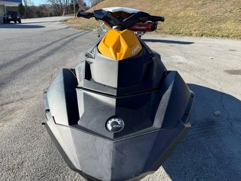 Slide: The Image of 2018 Sea-Doo Spark 3up jet ski, black and yellow, parked on pavement. - 24