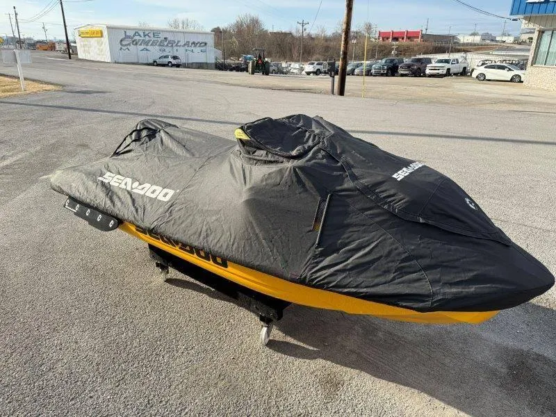 Slide: The Image of 2022 Sea-Doo RXP-X 300 covered, parked outdoors on pavement. - 17