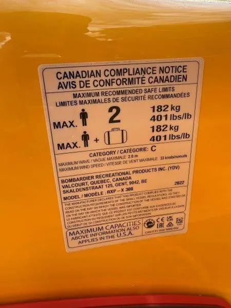 Slide: The Image of Canadian compliance notice on 2022 Sea-Doo RXP-X 300, detailing weight and passenger limits. - 24