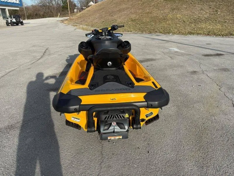 Slide: The Image of 2022 Sea-Doo RXP-X 300 in yellow, parked on a paved surface. - 4