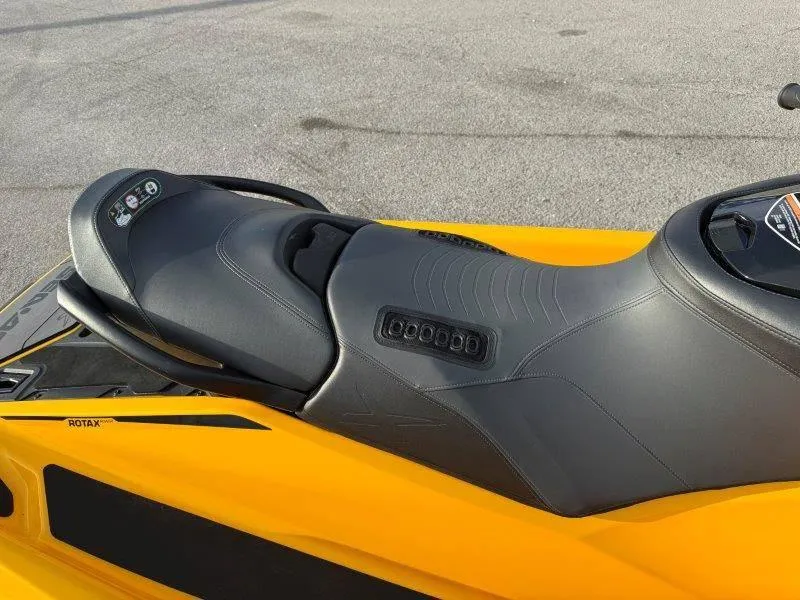 Slide: The Image of 2022 Sea-Doo RXP-X 300 jet ski seat, black and yellow design, close-up view. - 8