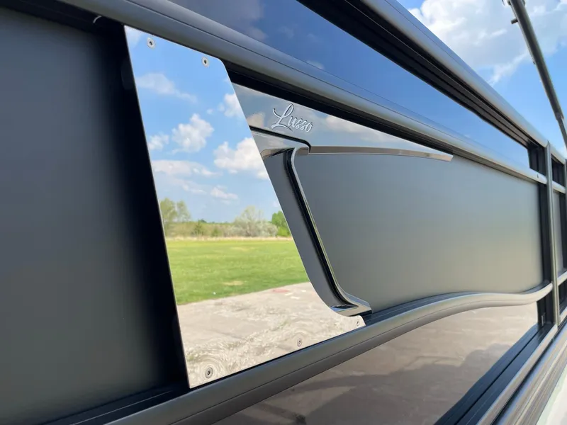 Slide: The Image of 2023 Barletta Lusso 25UCA exterior detail with sleek design and reflective surface. - 18