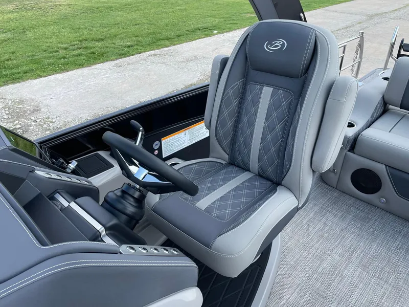 Slide: The Image of Captain's chair in 2023 Barletta Lusso 25UCA pontoon boat, featuring luxurious design and comfort. - 27