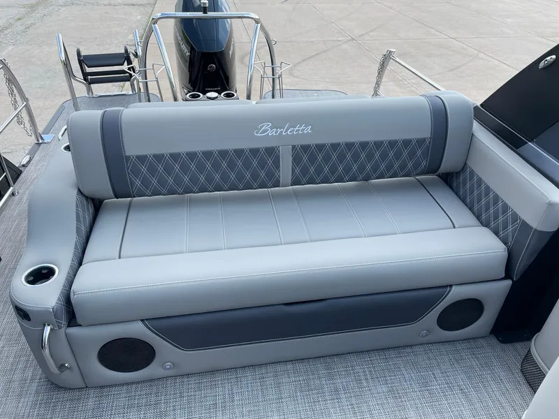 Slide: The Image of 2023 Barletta Lusso 25UCA boat seat with gray upholstery and cup holders. - 28
