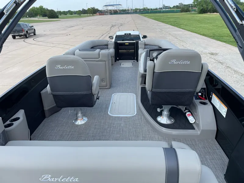 Slide: The Image of 2023 Barletta Lusso 25UCA pontoon boat interior with luxurious seating and spacious layout. - 30