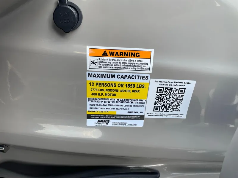 Slide: The Image of 2023 Barletta Lusso 25UCA capacity label, warning, and QR code on boat surface. - 33