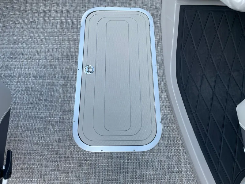 Slide: The Image of 2023 Barletta Lusso 25UCA boat floor hatch with textured surface and secure latch. - 34